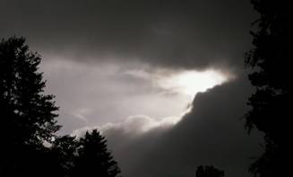 Sun_Through_Dark_Storm_Clouds_Large.jpg